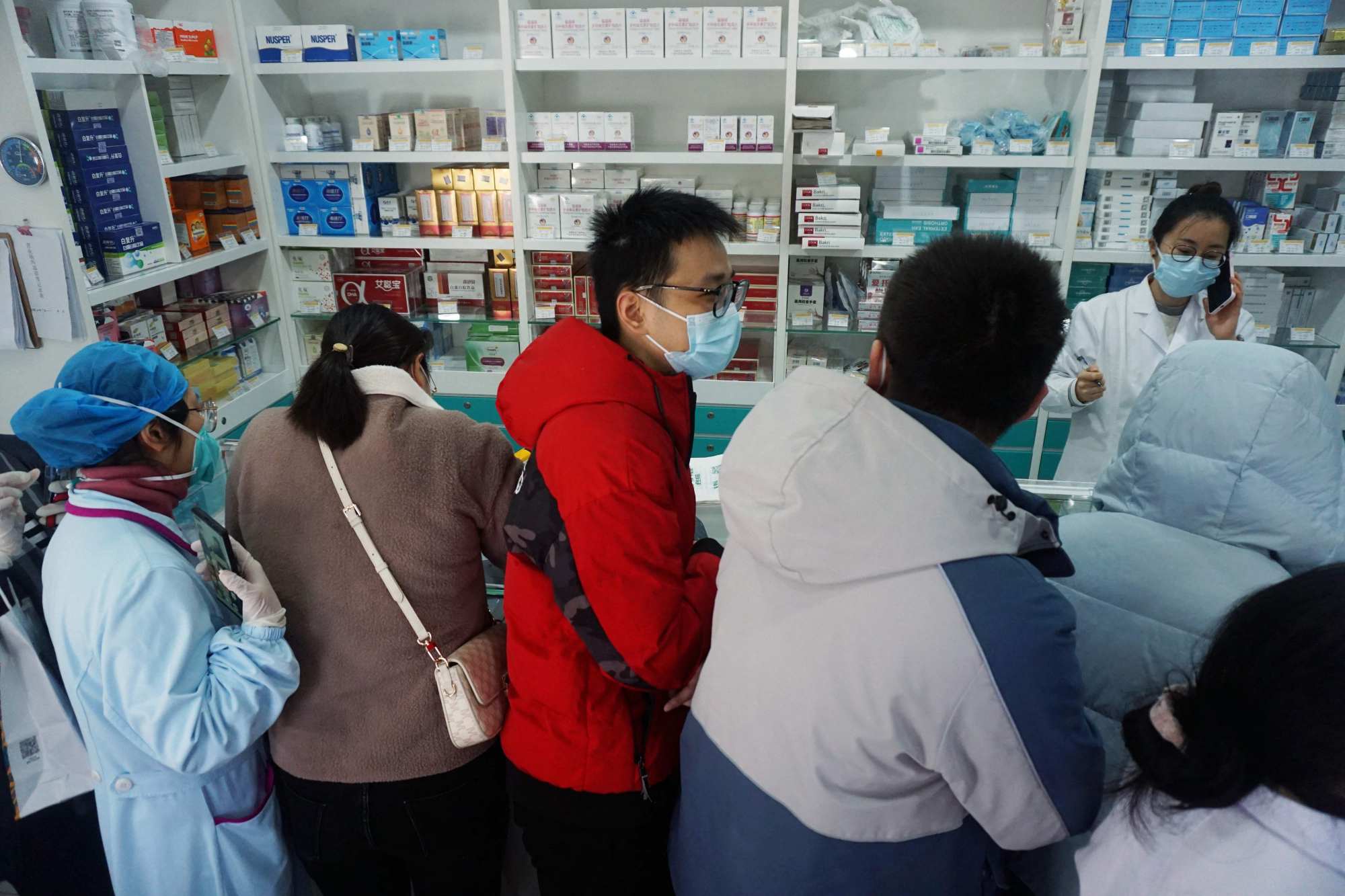 Queues for Covid-19 supplies at a pharmacy in Hangzhou, in China’s eastern Zhejiang province. Photo: AFP