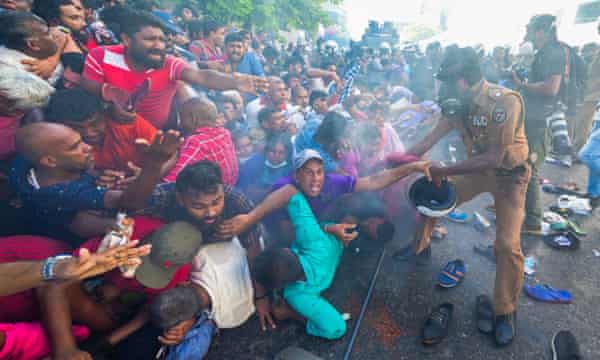 Police fire tear gas to disperse supporters of the opposition National Peoples Power (NPP) party during a protest to urge the government to hold local council election as scheduled in Colombo on 26 February 2023.