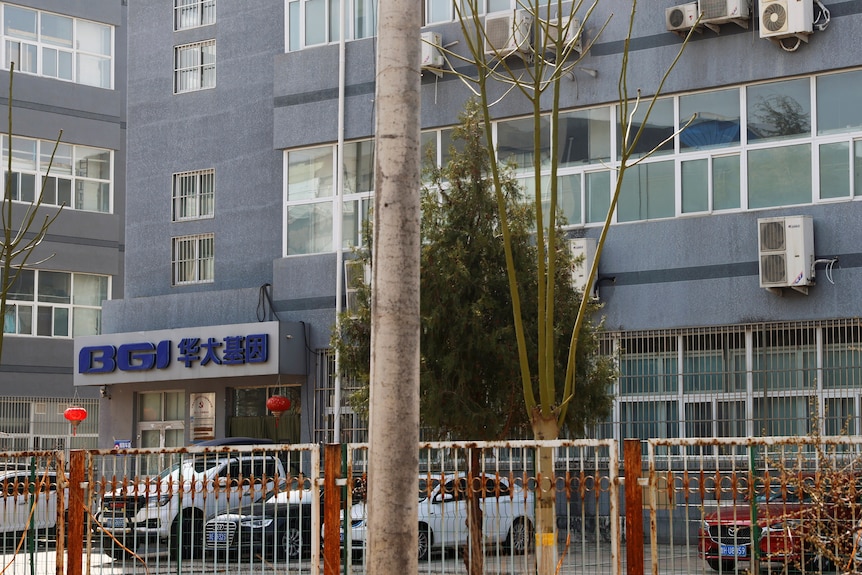 The exterior of a building with BGM and some Chinese letters over the entrance.