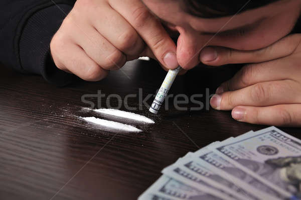 5270320_stock-photo-man-snorting-cocaine.jpg