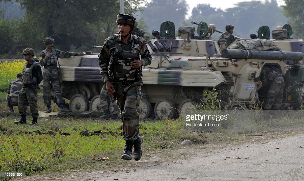 indian-army-soldiers-take-position-during-a-gun-battle-with-armed-picture-id459681890.jpeg