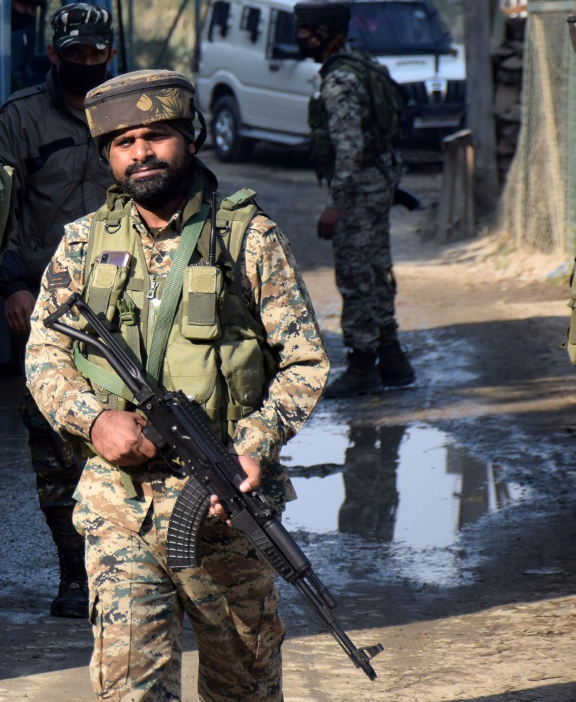 Kashmir-Security-personnel-in-action-near-the-residential-house-where-militants-were-hiding-du...jpg