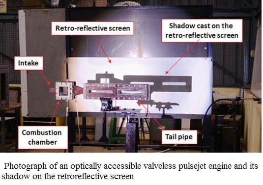 Photograph of an optically accessible valveless pulsejet engine and its shadow on the retroref...jpg