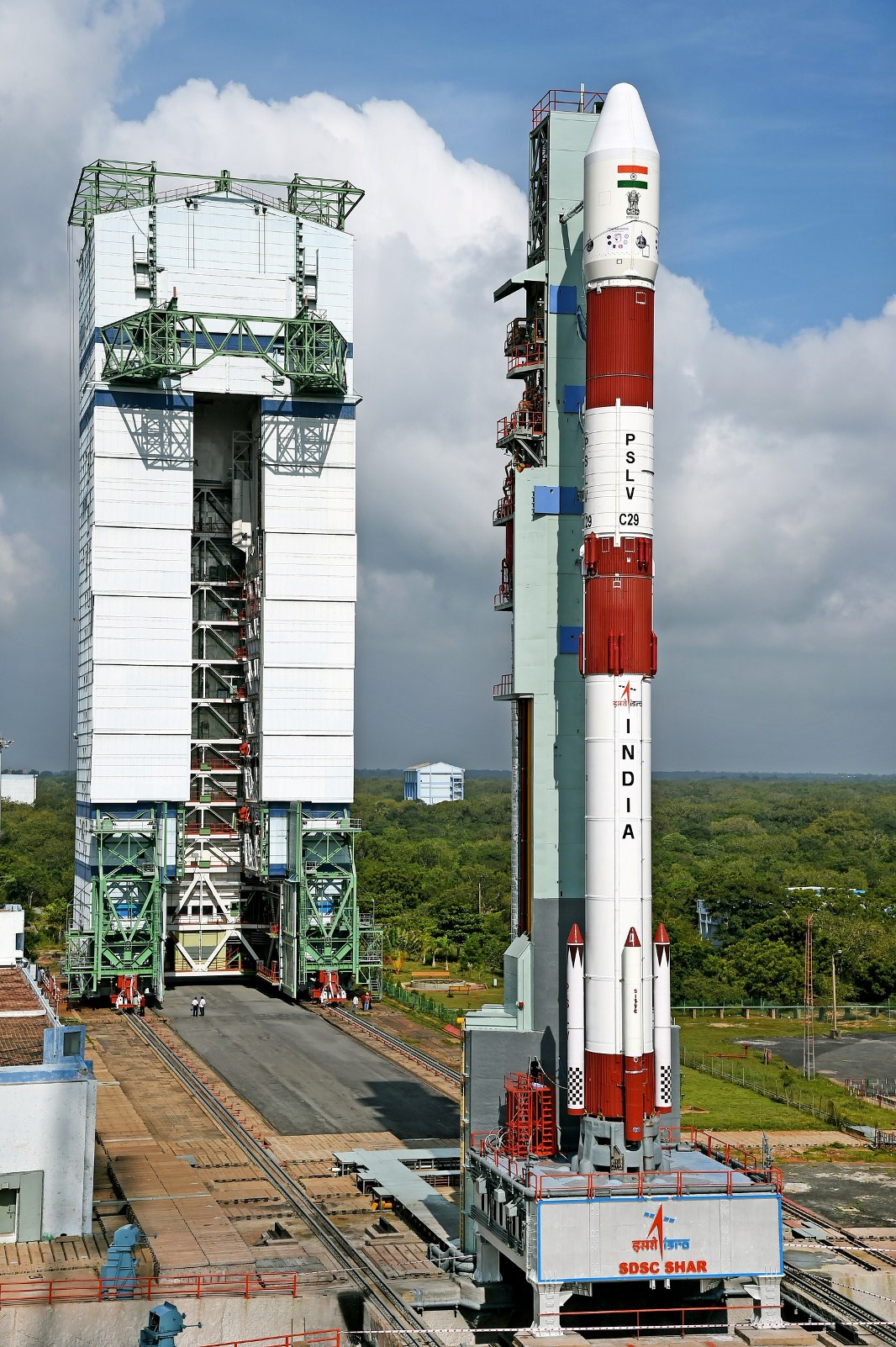 pslv-c29_on_the_first_launch_pad_with_vehicle_assembly_building_in_background.jpg