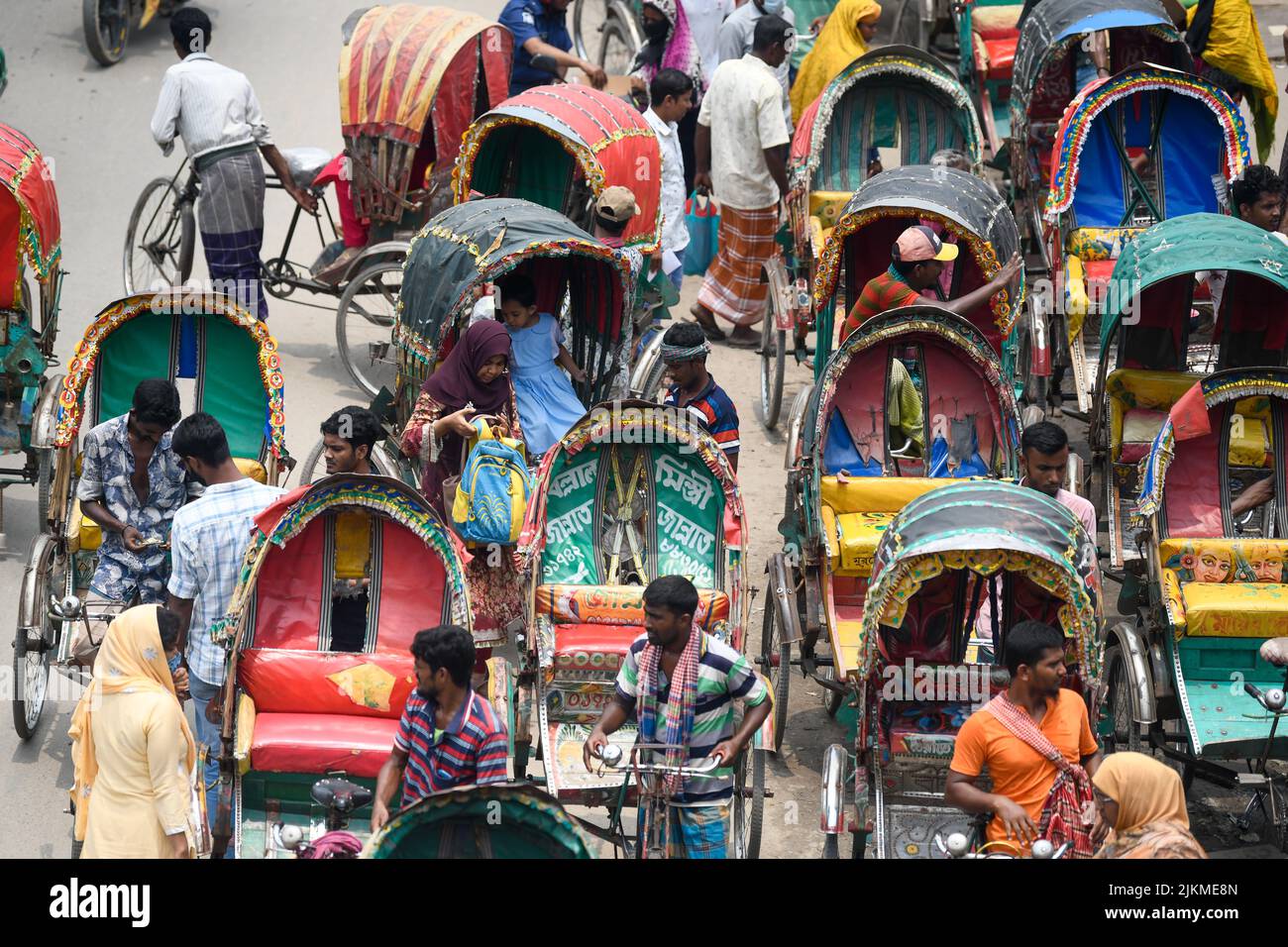 rickshaw-pullers-seen-waiting-for-customers-on-the-streets-of-dhaka-bangladesh-2JKME8N.jpg