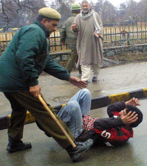 Shia_Mourner_being_assaulted_by_Omar_Abdullah_Regime_on_the_eve_of_Ashura.jpg