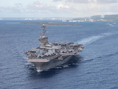 The aircraft carrier USS Theodore Roosevelt (CVN 71) departs Guam's Apra Harbor on June 4, 2020. (Mass Communication Specialist Seaman Kaylianna Genier/Navy)