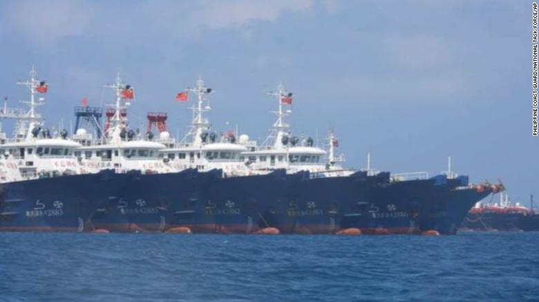 In this March 7, 2021, photo provided by the Philippine Coast Guard/National Task Force-West Philippine Sea, some of the 220 Chinese vessels are seen moored at Whitsun Reef, South China Sea. 