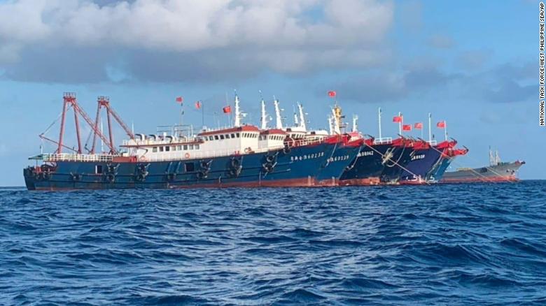 In this photo provided by the National Task Force-West Philippine Sea, Chinese vessels are moored at Whitsun Reef, South China Sea on March 27, 2021.