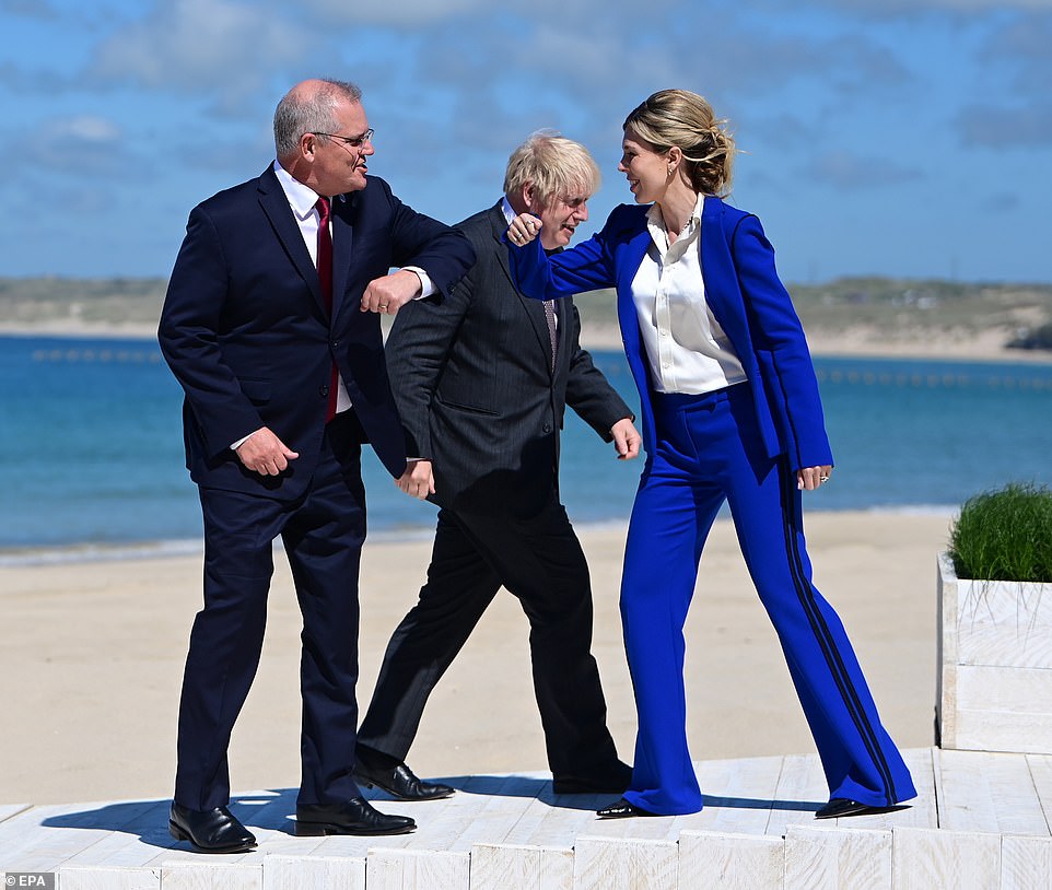 The meeting was the culmination of an 18-month plan to acquire the technology by Mr Morrison (left), who first pitched the idea to Boris Johnson (right, with wife Carrie Symonds) before arranging a three-way sit-down with Biden