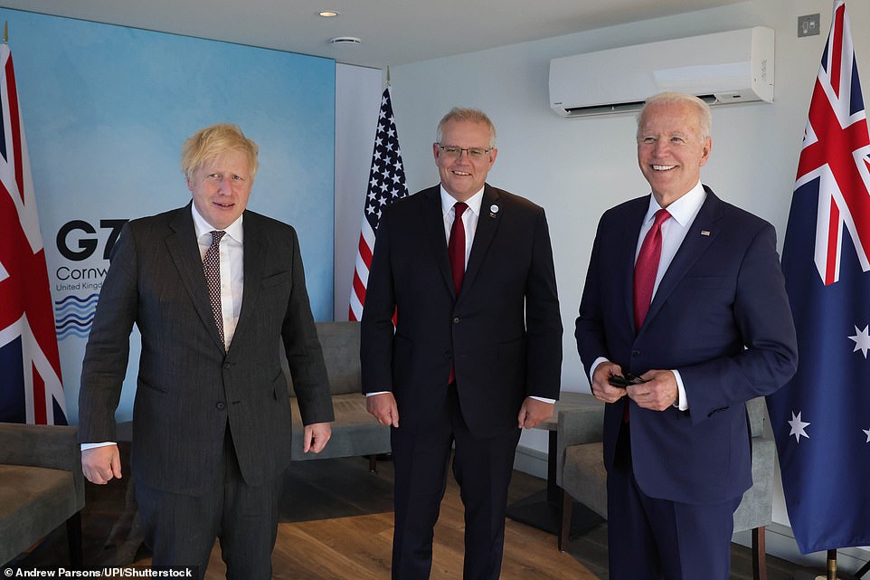 Scott Morrison meeting with Boris Johnson and Joe Biden at the G7 summit in Cornwall back in June, where the trio put pen to paper on a new military alliance that will give Australia its first nuclear-powered submarines