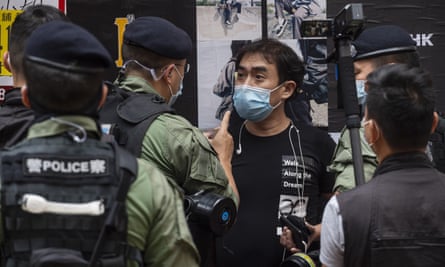 Riot police officers stop and search a protester during a protest in Hong Kong at the beginning of October. 